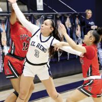Phallyn McHenry-Guzman attempts to grab the ball knocked from her hands