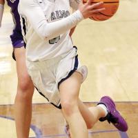 Reagan Bugaj uses her body to protect the ball