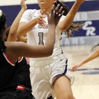 Jaylin Reveles shoots a layup