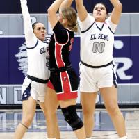 Phallyn McHenry-Guzman (3) and Lilly Thomas (00) pressure an Elgin player into making a pass