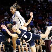 Ashlyn Evans-Thompson throws up a shot attempt