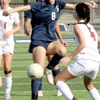 Conley Knapp uses her body to direct the ball