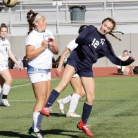 Joey Lierle kicks the ball away from a Choctaw defender