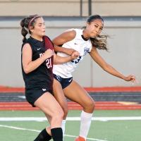 Ja’Niya Loreto (23) deflects the ball past a Duncan player before the pair collided