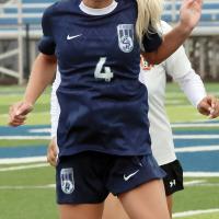 Lily Hayes leaps into the air to steal a Guymon throw-in with her head
