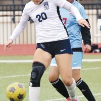 Samantha Curtis screens off a Western Heights player with her body as she dribbles the ball