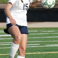 Carlie Golden uses her upper body to control a pass