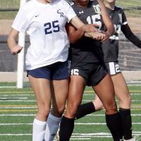 Leslie Valdez collides with a Lawton MacArthur player
