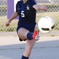 Caroline Huber follows through on a corner kick