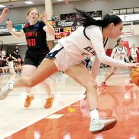 Emmary Elizondo dribbles out of trouble after pulling down a rebound