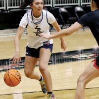 Carley Kihega dribbles against a defense
