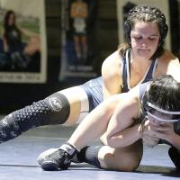 Kaylee Davis sets up Noble’s Kaleena Atkins for a takedown move