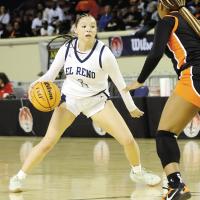 Emmary Elizondo dribbles at the top of the key