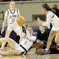 Raegan Bugaj makes a pass to Juliana Thomas while teammate Maddie Moss looks on