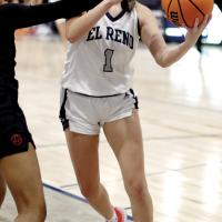 Emmary Elizondo eyes the basket while taking a shot under a defender’s arm