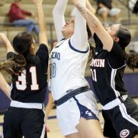 Lilly Thomas is fouled while shooting