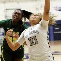 Pauline Black-Harmon reaches up to catch a lob pass