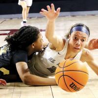 Ashlyn Evans-Thompson reaches out to grab a loose ball