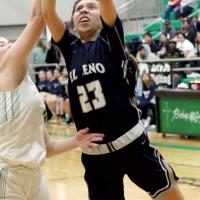 Tetona Blackowl shoots a layup around the block of a defender