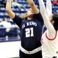 Pauline Black-Harmon eyes the basket while shooting over a Mustang defender