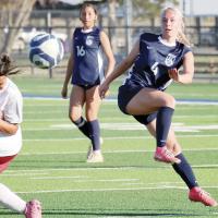 Lily Hayes follows through on a shot attempt past a Capitol Hill defender
