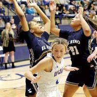 Janae Black-Harmon and her sister Pauline try to pull down an offensive rebound