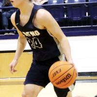 Alex Elizondo (24) brings the ball up the court