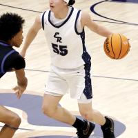 Alex Elizondo works the ball up the court