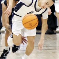 Bradley Island gets knocked down from behind while trying to chase down a loose ball