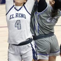 Eryn Roman Nose reaches back to try and grab a rebound