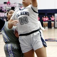 Lilly Thomas shoots a left-handed bank shot around a defender