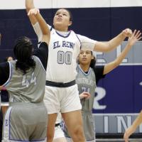 Lilly Thomas reaches up for the opening tipoff