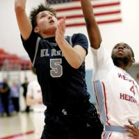 Carter Roman Nose uses his body to screen off a defender