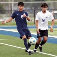 Carlos Garcia passes the ball down the field