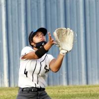 Krystiana Guzman slides down to the ground