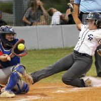 Chenoa White slides into home just ahead of a relay throw
