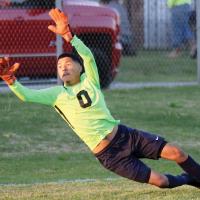 Angel Gonzalez dives to try and block a shot