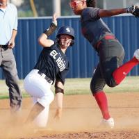 Iliana Ashford slides into second as a Carl Albert infielder misplays the pickoff throw