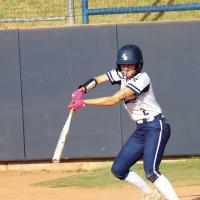 Maddy Brinkman slaps the ball into the air