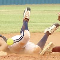 Maddy Brinkman looks back at the ball after sliding headfirst into second