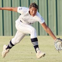 Addilinn Johnson reaches out to try and snag a fly ball to center field before it hits the ground