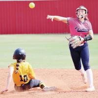 Zoey Pawnee steps off the bag to make a throw toward first base on a double play attempt