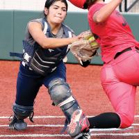 Sarah Hernandez tags out a Carl Albert runner at the plate