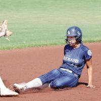 Addilinn Johnson slides into second base ahead of a pickoff throw