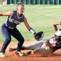 Natalie Gion reaches down to glove a throw to the bag