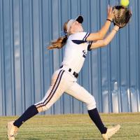 Brailynn Vickery chases down a fly ball
