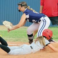 Alyssa Duran tries to block a pickoff throw to the bag