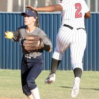 Ryah Hartley steps off first to avoid a collision with a Del City player