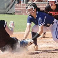 Zoey Pawnee tags out a Duncan base runner at the plate