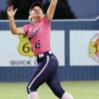 Kyla Killingsworth leaps into the air to snag a fly ball